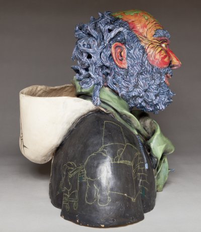 right view of ceramics sculpture of homeless man